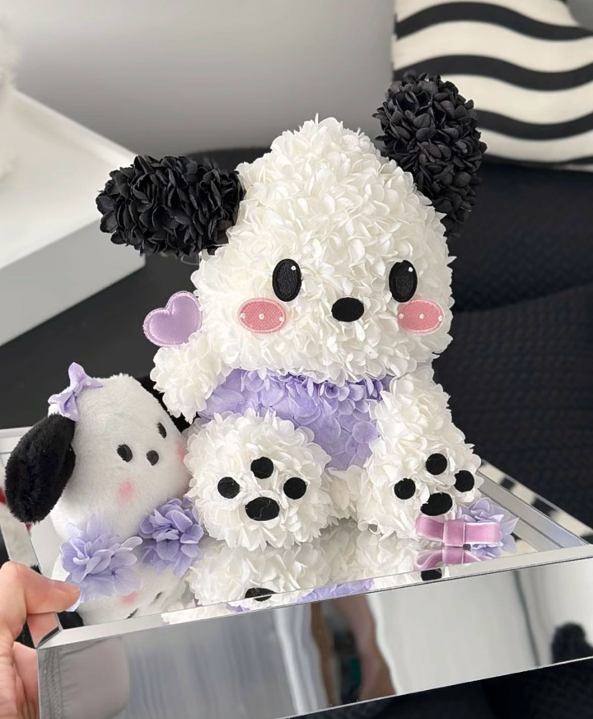 A soft, plush-style preserved flower character design by The Floral Muse